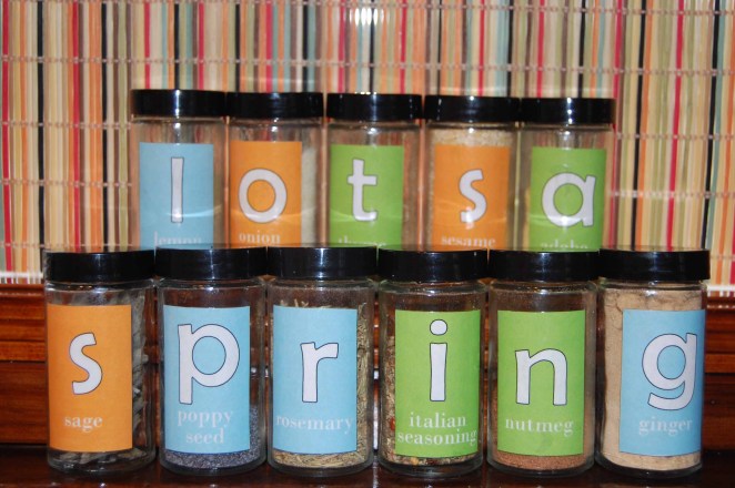 Spring message spelled out in spice jars